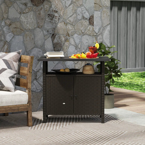 Wicker Outdoor Storage Cabinet With Rattan Bar Table And Two Doors, Open Shelf, 46.6 Gallon Enclosed Storage, Weatherproof Poolside Buffet Console With A Metal Slatted Countertop For Patio Backyard Dark Coffee Finish in an outdoor setting.