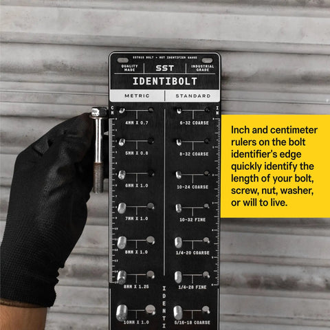 Person holding Identibolt Precise Threadchecker And Wall Mount Kit For Imperial SAE And Metric Threads against brick wall.