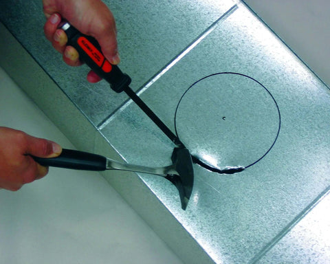 Heavy Duty Duct Slicer for Metal Ducting with beveled edge notch cutting sheet metal, showcasing shock absorbing handle and steel shaft
