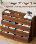 Mid Century Modern Dresser Boasting Eight Spacious Drawers And A Rich Walnut Finish Resting On Robust Wood Legs with clothes organized inside.
