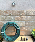 3 Ply Reinforced Rubber Garden Hose Half Inch By Fifty Feet Lightweight Flexible DIY Hose Set on patio with fittings