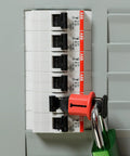 Miniature Circuit Breaker Lockout Pin-Out, Standard DIN Style on electrical panel, for 120/277 VAC European machinery, red lock engaged.