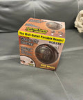 Box of a 900 watts warm air blower portable heater on a gray sofa
