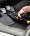 Using Crevice Tool for Tight Spaces and Hard to Reach Crannies with Brass Spray Jet in car footwell, cleaning pedals.