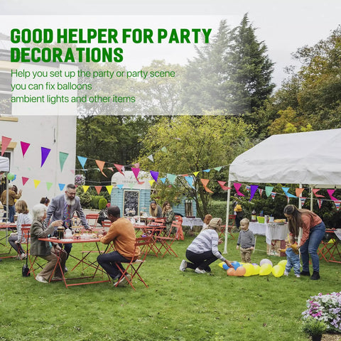Outdoor garden party with people setting up decorations and arranging colorful balloons and bunting under tents and trees.
