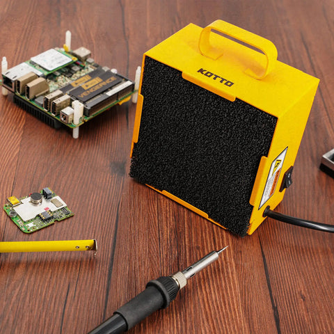 Solder Smoke Absorber And Fume Extractor For Soldering Station DIY Working Fan With Zero Point Four Inch Activated Carbon Filter Keeps Your Shop Fresh And Odor Free Portable Yellow Unit on workbench.