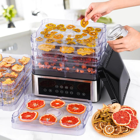 No Stress Food Dehydrator With Eight Stainless Steel Trays, drying fruits, digital timer, and heat settings visible on counter.