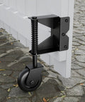 4 Inch Gate Wheels With Spring Loaded Caster And 360 Degree Universal Mount Plate installed on white wooden gate