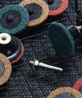 92-Piece 2-Inch Sanding Discs Set With One Quarter Inch Shank Holder for Die Grinder, featuring various grit colored discs.