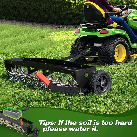40-Inch Tow Behind Spike Aerator With Galvanized Steel Tines attached to tractor on lawn