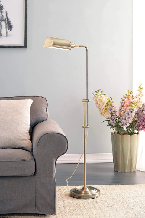 Antique Brass Floor Lamp With Adjustable Height And Swivel Head, Classic Mid Century Modern Vibe, near grey sofa with flowers