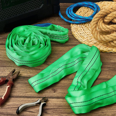 Four Pack Heavy Duty Polyester Endless Loop Round Lifting Straps For Hoists, Towing And Moving Furniture, Four Feet Long, Round Slings, Safe Rigging Gear, 10600 Lb Basket Capacity, 5300 Lb Vertical, 4200 Lb Choker, Green on a wooden surface.