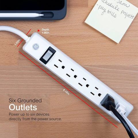 4 Pack 6 Outlet Power Strip With 12 Ft Extension Cord on desk, closeup of grounded outlets with heavy duty flat plug, white