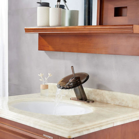 Oil Rubbed Bronze Waterfall Bathroom Sink Faucet With Brass Modern Circle Glass Disk Rinser, shown on marble sink setup