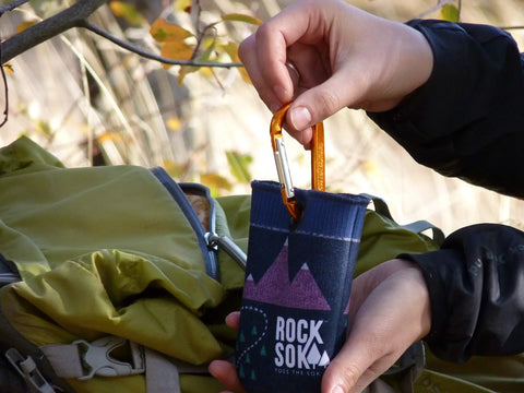 Bear Bag Food Hanging System For Camping And Hiking With 2 To 1 Pulley shown with Rock Sok and carabiner in use outdoors.