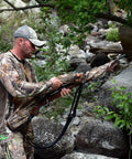 Hunter using Heavy Duty Weatherproof Long Rifle And Shotgun Slicker All Weather Rain Guard Alpine Mountain Camo Fits 38 To 56 Inch Barrels For Rifles Or Shotguns 2 Pack D24 in rocky forest