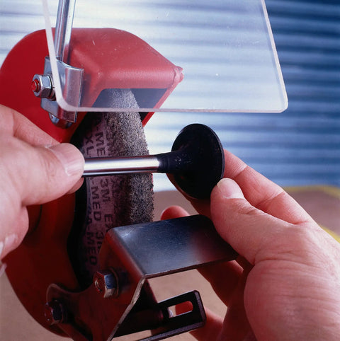 Hands using Bench Motor Deburring And Finishing Wheel Nonwoven Unitized Dressable Wheel 6 Inch Diameter Medium Grit Aluminum Oxide