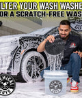 Man using Ultimate Car Wash Bucket Kit With Dirt Trap Insert, Microfiber Mitt, Soap, And Lid for Scratch Free, Swirl Free Washing.