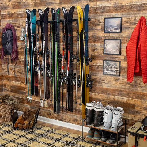 Heavy Duty Wall Mount Ski Rack That Locks Up To Five Pairs Smoothly keeps skis organized on a wooden wall, under 300 lb limit.