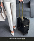 Chelsea Chevron Quilted Underseat Carry On Luggage Black With Gold Accent Zippers And Slick Four Wheel Spinner 17 Inch in a room