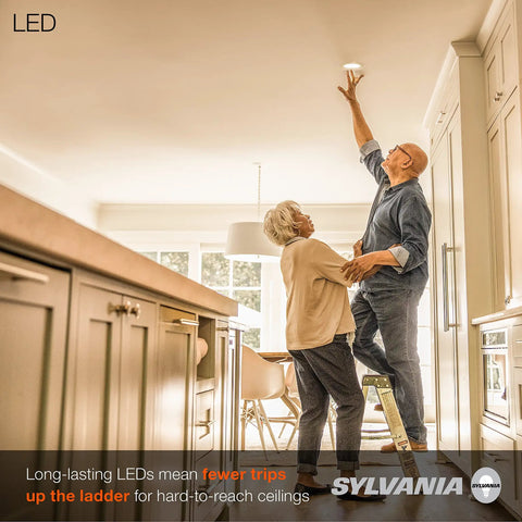 Elderly couple installing Five To Six Inch LED Recessed Downlights With Trim, Dimmable 9W Equal To 65W in kitchen ceiling