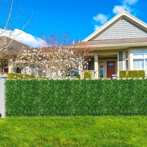 Artificial Hedge Wall Panels 20x20 Inch Boxwood Set, 12 Pieces installed outdoors as a lush privacy fence screen in a residential yard