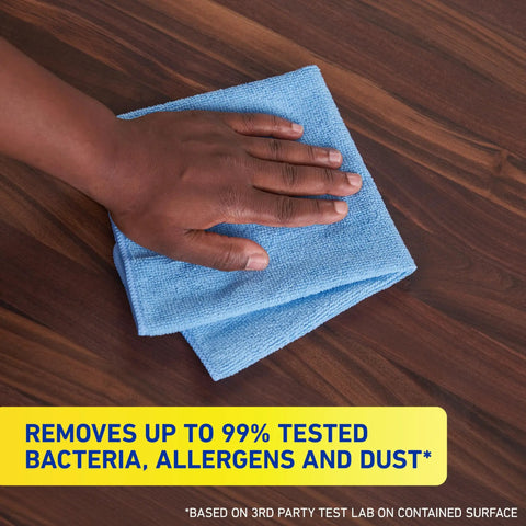 Hand using Microfiber Cleaning Cloth Bundle 14 By 14 Inches Blue Pack Of 24 Washable And Reusable on wooden surface