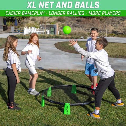 Slammo XL Extra Large Round Net Game For Beginners setup with children playing, featuring net, balls, at outdoor gathering.