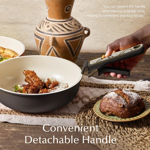 Nonstick Ceramic Cookware Set With Detachable Handle, 21 Pieces in use, charcoal finish, on table with bread and jug