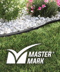 Heavy Duty 40 Foot Landscape Edging Kit With YardPack 5 Inch Flexible Lawn Border outlining a garden bed with flowers