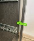 3 Piece Adjustable Carpenter Jig Set Helps You Nail Scribing Fillers And Toe Kicks Dead On With No Sweat Setup on a cabinet side.
