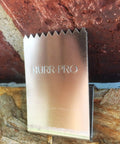 Universal Stainless Steel Hurricane Window Clips For 1/2 To 3/4 Inch Plywood Or OSB showing detail against brick and plywood.