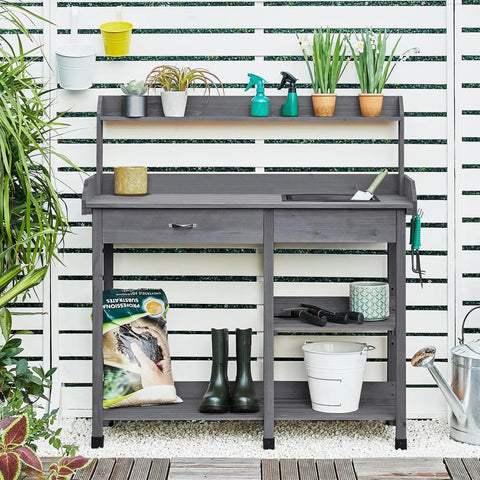 Outdoor Potting Bench Table All In One Garden Workstation With Drawer Adjustable Shelf Removable Sink in gray fir wood with plants