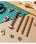 Half Moon Countertop Joint Bolts Kit For Tabletops And Furniture showing steel bolts and nuts on a work surface.