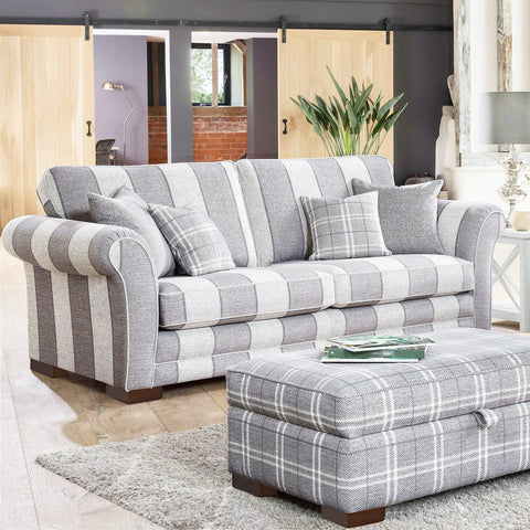 Striped sofa in living room with wooden sliding doors and solid wood furniture legs set with L shaped bed risers visible.