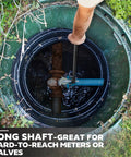 Long Reach 48 Inch Water Meter Key With Wide T Handle For Easy Valve Access being used to turn a valve in a meter pit