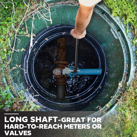 Long Reach 48 Inch Water Meter Key With Wide T Handle For Easy Valve Access being used to turn a valve in a meter pit