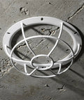 Tough As Nails Smoke Sensor Protective Cage With Heavy Duty Vandal Resistant Fire Alarm Sprinkler Cover displayed against concrete wall.