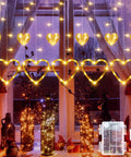 Heart Curtain Lights For Valentine's Day And Romantic Room Vibes USB Plug Or Battery Powered 123 LED 11 Heart Light Up String Lights In Warm White Ideal Window Bedroom Closet Wall Decor displayed in window