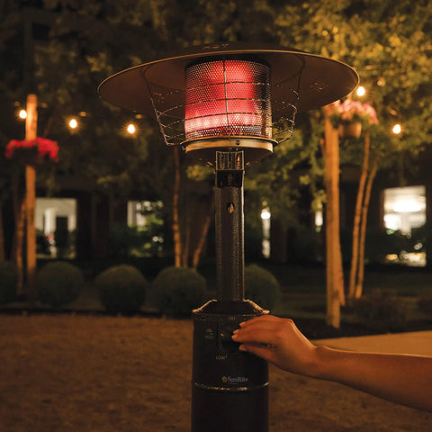 Person adjusting Tabletop Patio Heater With Adjustable 8,000 To 11,000 BTU Heat Heats Up To 275 Sq Ft Runs On 1lb Propane Tank Not Included