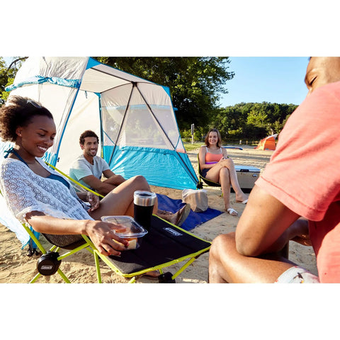 People enjoying a campsite with Space Saving Outdoor Camp Furniture Set With Chair, Cot, And Table Carry Bag Included Compact 3 In 1 Gear