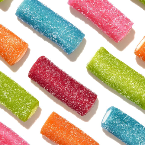 Colorful mixed fruit rope candy pieces with sugar coating. Mixed Fruit Rope Bites Candy In A Reusable 8 Ounce Bag With Chewy Tart Filling.
