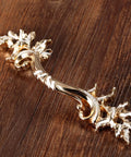 Gold Antique Dresser Handles Set Vintage French Provincial Style Cabinet Pulls for nightstands and dressers on wood surface.