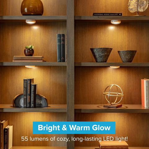 Wireless LED Puck Lights 3 Pack With Remote Control For Under Cabinet Lighting shown installed on wooden shelves.
