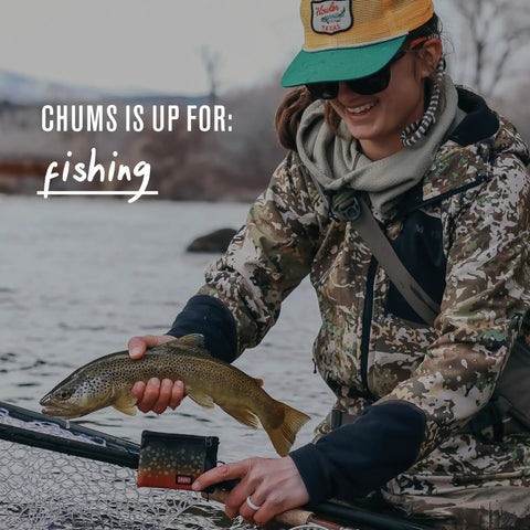 Person fishing with Surfshorts Wallet With RFID Blocking Clear ID Window Zippered Pocket And Key Ring Water Resistant Slim Card Holder