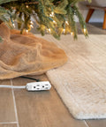 Heavy Duty Three Outlet Flat Extension Cord 3 Feet Long Grounded Power Cable With Secure Three Prong Plugs For Home Office Setup And Sleek Under Desk Layout under Christmas tree with soft beige rug.