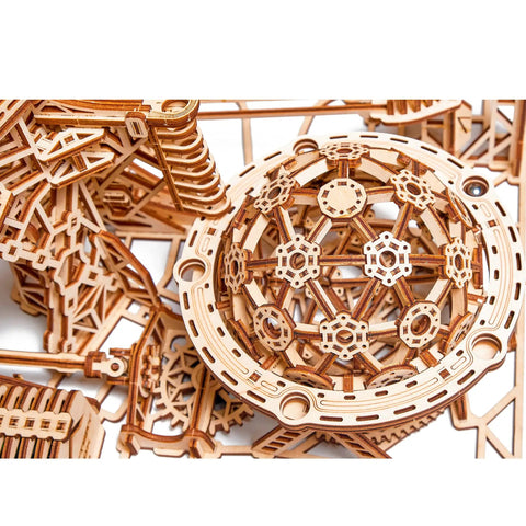 Close-up of assembly pieces from Electric Motorized Wooden Marble Run Kit For Adults A Dope 3D Puzzle That You Build Yourself