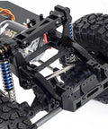 Close-up of One Tenth Scale RC Crawler Chassis Kit With 313mm Wheelbase, showing nylon frame, 35T motor, and axles.