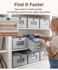 Top Shelf Fabric Storage Bins With Clear Mesh Windows And Tough Pull Handles Level Up Your Closet Game In Clean Grey Four Pack For Easy Peasy Organization, with clear viewing windows and a user organizing clothes.