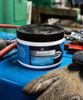 Go-To Premium Mineral Base Marine Grease With Water-Resistant Formula, Heavy-Duty Lubricant, 16 Oz Tub on a workbench